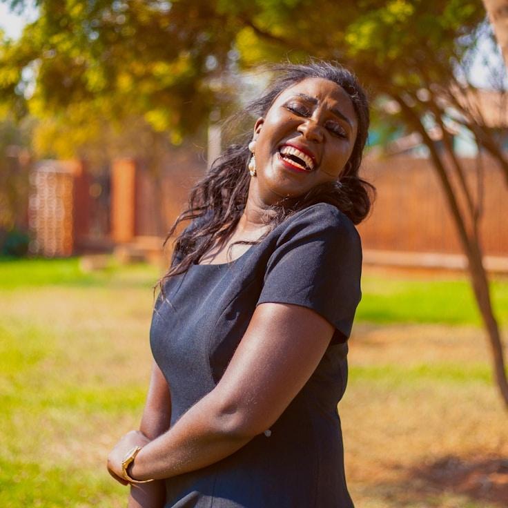 Alex Rivera, Lead Design Curator at MeadowQuartzHarbor, reviewing corporate floral arrangements